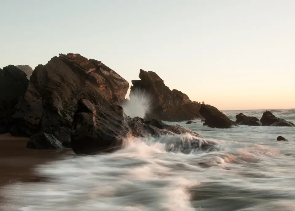 Waves on the Portuguese Atlantic coast at dusk, weighing whether the Golden Visa is worth it